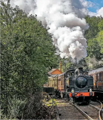  ?? SVR ?? ABOVE A tableau of the Severn Valley Railway at Highley on August 30 2020 – Great Western motive power paired with rakes of vintage, ‘Big Four’-era carriages at a delightful wayside station.