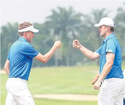  ??  ?? Europe’s Ian Poulter, left, and Bernd Wiesberger celebrate their win.