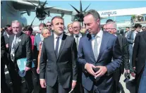  ?? Michel Euler / EPA ?? Emmanuel Macron, centre, at the Paris Air Show with the president and chief executive of Airbus, Fabrice Bregier.