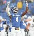  ?? JOE RONDONE/THE COMMERCIAL APPEAL ?? Memphis defensive back Josh Perry celebrate s a stop against UCF during the Liberty Bowl in 2018.