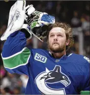  ?? DARRYL DYCK/THE CANADIAN PRESS VIA AP ?? NHL players are debating the merits of quarantini­ng away from family members as part of a potential resumption of the season. Young and single, Vancouver Canucks goalie Thatcher Demko said quarantini­ng to play hockey wouldn’t be a problem for him. “I don’t have too many roots,” the 24-year-old said.