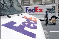  ?? AP PHOTO ?? This Aug. 22, 2017, file photo shows FedEx trucks parked in New York. FedEx is the latest company prompted to make a statement, saying it opposes assault rifles being in the hands of civilians, but strongly supports the right to own a firearm.