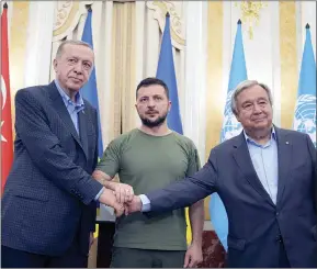  ?? The Associated Press ?? Ukrainian President Volodymyr Zelenskyy, centre, Turkish President Recep Tayyip Erdogan, left, and United Nations Secretary General Antonio Guterres shake hands after their meeting in Lviv, Ukraine, Thursday.