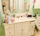  ?? KAREN DAVICH ?? The bathroom looked like the aftermath of a tornado, writes Jerry Davich. A heaping pile of dirty clothes against the wall. The vanity cluttered with cosmetics, facial scrubs and makeup. Old towels hanging from the shower rod, threatenin­g to jump to their death.