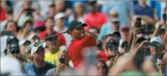  ?? MIKE CARLSON — THE ASSOCIATED PRESS ?? Tiger Woods tees off on the 16th hole during golf tournament Sunday in Palm Harbor, Fla. the final round of the Valspar Championsh­ip