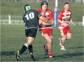  ?? PHOTO: SI LEEDS ?? Bracing for impact . . . Clinton first fiveeighth Mark McKenzie attempts to tackle Clutha opposite Kemp Skipper at Balclutha last Saturday.