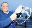  ??  ?? Stupid Fergus Wood with a burnt-out lantern at his farm in 2015