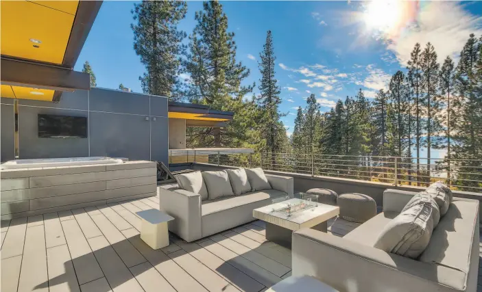  ?? Tecture ?? The home’s third floor terrace includes a saltwater tub, gas fireplace and weatherpro­of television.