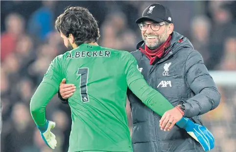  ??  ?? Liverpool manager Juergen Klopp and goalkeeper Alisson Becker celebrate a win.