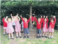  ??  ?? Nursery children at Mottram St Andrew Primary Academy celebrate