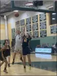  ?? SENTINEL & > ENTERPRISE / NICK MALLARD ?? Oakmont Regional’s Ryan Hulecki shoots over Greater Lowell Tech’s Greyson Mcdonald during Friday night’s game.