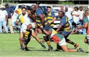  ?? Picture:THEO JEPTHA ?? BREAKING FREE: EL Police’s Ayabonga Nomboyo takes on Harlequins’ defence at Police Park in East London yesterday