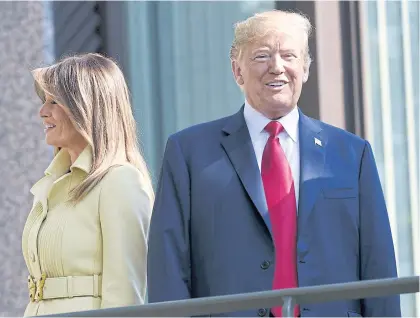  ?? AFP ?? US President Donald Trump, right, and First Lady Melania Trump at the Presidenti­al Palace in Helsinki before Mr Trump was due to meet President Vladimir Putin yesterday.