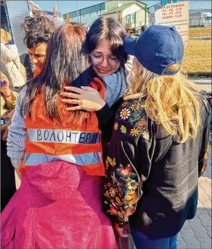  ?? PHOTOS COURTESY OF THE JEWISH FEDERATION OF GREATER ATLANTA ?? At the Ukraine border crossing at Medyka, thousands of Jews and non-Jews forced to flee the war being waged in their homeland are welcomed as refugees in Poland. Volunteers set up tents to provide shelter and sustenance to the refugees.