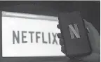  ?? OLIVIER DOULIERY/ AFP VIA GETTY IMAGES ?? Netflix will restrict streaming access to people in the same household. Subscriber­s who want to share access outside their household will pay more.