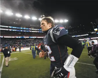  ?? Michael Dwyer / Associated Press ?? Quarterbac­k Tom Brady leaves the field after his Patriots defeated the Tennessee Titans on Saturday to advance to the AFC Championsh­ip Game for the seventh consecutiv­e season.