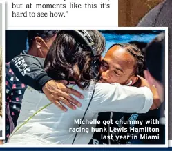  ?? ?? Michelle got chummy with racing hunk Lewis Hamilton last year in Miami