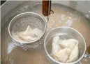  ?? ?? Benjamin B. Braun/Post-Gazette Dumplings are cooked for 6 minutes at Bae Bae’s Kitchen.