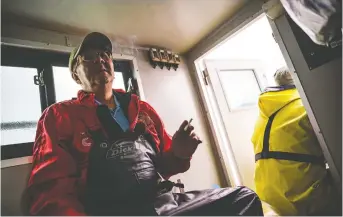  ??  ?? Nobuo Sugimura, 63, takes a smoke break as he and other fishermen on the Hokushin Maru head back to mainland Japan after catching salmon from the Sea of Okhotsk.