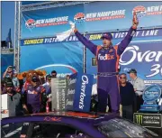  ?? Charles Krupa / The Associated Press ?? Driver Denny Hamlin celebrates after winning the NASCAR Cup Series 301 race at New Hampshire Motor Speedway in Loudon, N.H., on Sunday.