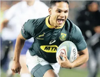  ?? KIM LUDBROOK EPA ?? HERSCHEL Jantjies scores one of his two tries during South Africa’s Rugby Championsh­ip win over Australia at Ellis Park.
|