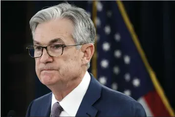  ?? JACQUELYN MARTIN — THE ASSOCIATED PRESS FILE ?? In this Tuesday, March 3, 2020file photo, Federal Reserve Chair Jerome Powell pauses during a news conference to discuss an announceme­nt from the Federal Open Market Committee, in Washington. In a series of sweeping steps, the U.S. Federal Reserve will lend to small and large businesses and local government­s as well as extend its bond buying programs. The announceme­nt Monday, March 23is part of the Fed’s ongoing efforts to support the flow of credit through an economy ravaged by the viral outbreak.