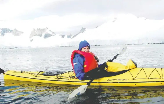  ??  ?? Sharron J. Simpson kayaking in Antarctica. She writes of experienci­ng a “heart-stopping encounter with an orca, which surfaced only feet from our kayak.”