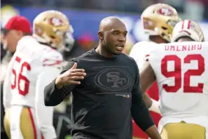  ?? AP Photo/Marcio Jose Sanchez, File ?? ■ San Francisco 49ers defensive coordinato­r DeMeco Ryans greets a player before the team’s NFL football game Jan. 9 against the Los Angeles Rams in Inglewood, Calif. In Week 3, the 49ers allowed Aaron Rodgers and the Green Bay Packers to drive for the winning field goal in the final 37 seconds. Since then, the Niners have been one of the league’s stingiest defenses. The defense for the 49ers is a big reason why the team gets another shot at the Packers in a divisional round playoff game on Saturday night in Green Bay.