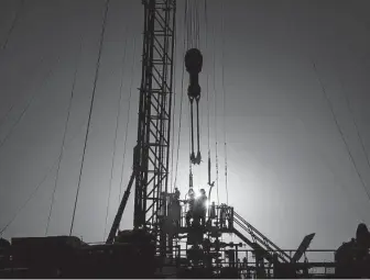  ?? Jon Shapley / Staff file photo ?? A drilling rig operates in Reeves County. Climate skeptics, or realists as they prefer to be called, don’t dispute that carbon emissions have caused the planet to warm over the past century.