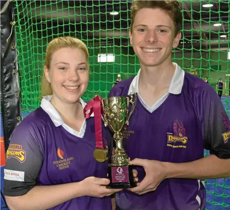  ?? Photo: Jason Gibbs ?? TWO-TIME CHAMPIONS: Toowoomba Dragons team-mates, siblings Amy and Matthew Nunn, celebrate the team’s 16-years Junior State Indoor Cricket title win.