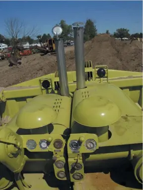  ??  ??  Look closely at the hood and stack levels in these images, plus the dash. The blade also angles with the oscillatio­ns. Riding this unique crawler gives you a different look at the work, not to mention being eight feet in the air.