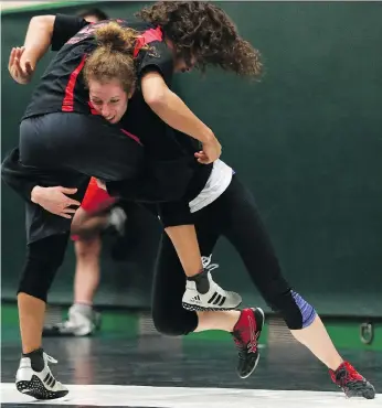  ?? MICHELLE BERG ?? University of Saskatchew­an Huskie female wrestler Alexandra Schell trains in the Education Wrestling Playroom in Saskatoon. The 21-year-old is a medal favourite for the upcoming Canada West championsh­ips.