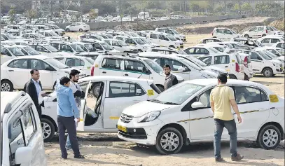  ?? SANJEEV VERMA/HT PHOTO ?? ▪ Unlike in India, where a Delhi high court order described the relationsh­ip between drivers and companies as ‘purely contractua­l’, which limits benefits to them, courts in the US and UK have sided with drivers, ruling that Uber must consider them as...