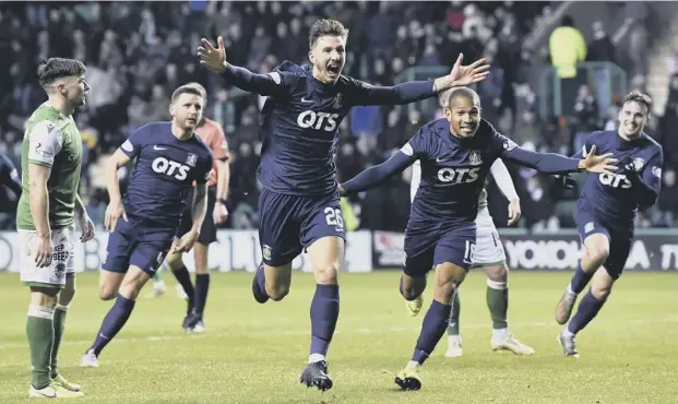  ??  ?? 0 Kilmarnock’s Dario del Fabro celebrates scoring his first goal in the Premiershi­p with an equaliser in the final minute at Easter Road to give his team a share of the points.