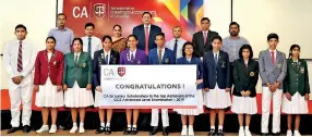  ??  ?? The 11 scholarshi­p recipients with CA Sri Lanka’s President elect Mr. Manil Jayesinghe, Vice President elect Mr. Sanjaya Bandara, other CA officials and lecturers.