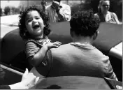  ?? ASSOCIATED PRESS ?? EVER REYES MEJIA, OF HONDURAS, CARRIES HIS SON TO A VEHICLE AFTER BEING REUNITED and released by Immigratio­n and Customs Enforcemen­t in Grand Rapids, Mich., on Tuesday. Two boys and a girl who had been in temporary foster care in Grand Rapids were reunited with their Honduran fathers after they were separated at the U.S.-Mexico border three months ago.