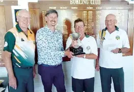  ?? ?? Right: Drouin’s Jan Aubrey helps her rink to a 30/12 win as Drouin proved too strong for Warragul in the midweek competitio­n. Drouin claimed the overall win 69/45.
Baw Baw Shire mayor Michael Leaney (second from left) presents the perpetual trophy at the conclusion of the Neerim District Bowling Club’s Australia Day tournament to the Neerim team of (from left) Greg Bond, Jim Fallon and Colin McKay