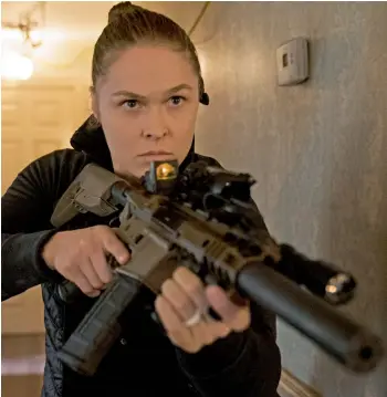  ?? Mile 22 ?? Former Olympic champion Ronda Rousey looks for trouble in a scene from the new thriller