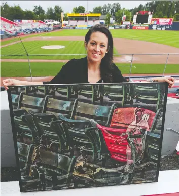  ?? NICK PROCAYLO ?? Vancouver artist Lauren Taylor, who has been commission­ed by Major League Baseball and a number of players to create portraits and works, displays one of her pieces at Nat Bailey Stadium last week.