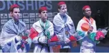  ??  ?? tunisiawor­ldtaekwond­o.com Iran’s Amir-sina Bakhtiari (2nd L) poses for a photo with his gold medal after finishing first in the men’s -55kg contests at the 2018 World Taekwondo Junior Championsh­ips in Hammamet, Tunisia, on April 10, 2018.