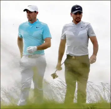  ?? STREETER LECKA / GETTY IMAGES ?? Rory McIlroy (left) and Jason Day were among the favorites at Erin Hills. But after two days of trudging through the fescue, their U.S. Open is over.