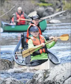  ?? KATHY JOHNSON ?? Drew Goreham (foreground) and Tylan Foster start down the rapids at Chrissy’s Falls during the Barrington River Run on May 12. The two fished their way along the route, catching four trout along the way.
