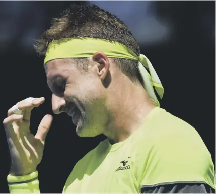  ??  ?? 2 American Tennys Sandgren reacts to a point during his quarterfin­al defeat by Korea’s Chung Hyeon at the Australian Open.