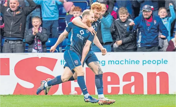  ?? ?? ON TARGET: Josh Sims, left, celebrates with fellow goalscorer Simon Murray after netting to give Ross County a 3-1 lead against Rangers.