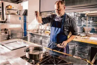  ?? ?? Michael Tusk, chef-owner of Quince and Cotogna, salts a pot of water while making raviolo di ricotta at Quince in San Francisco, Calif., Tuesday, Feb. 7, 2023.