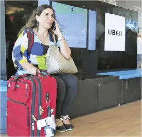  ?? AP ?? RIO DE JANEIRO: In this Nov 11, 2016 photo, Mirella Sanches, a 41-year-old architect, waits to be picked up at an Uber stand. —