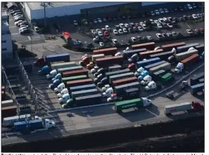  ?? (Bloomberg News WPNS/Bing Guan) ?? Trucks enter and exit the Port of Los Angeles in this file photo. The U.S. trade deficit rose in March to a record $109.8 billion.