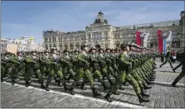  ?? AP 2022 ?? Russian servicemen have a dress rehearsal in 2022 for the Victory Day military parade in Moscow. Central to the narrative of an invincible Russia is the defeat of Nazi Germany on May 9, 1945, during World War II. No criticism of Soviet actions in that war is allowed.