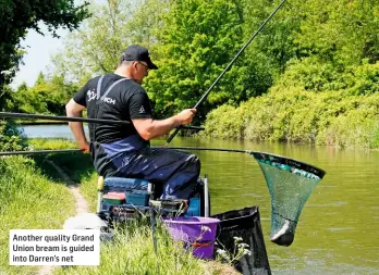  ??  ?? Another quality Grand Union bream is guided into Darren’s net