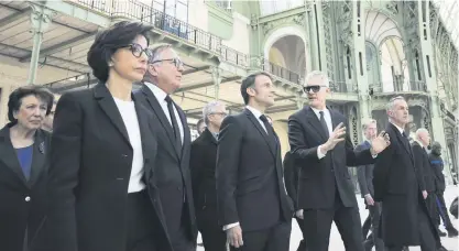  ?? PHOTO: AFP ?? France’s President Emmanuel Macron (third front left) flanked by France’s Minister for Culture Rachida Dati (left) and the president of Le Grand Palais, Didier Fusillier, during a visit to Le Grand Palais in Paris recently.